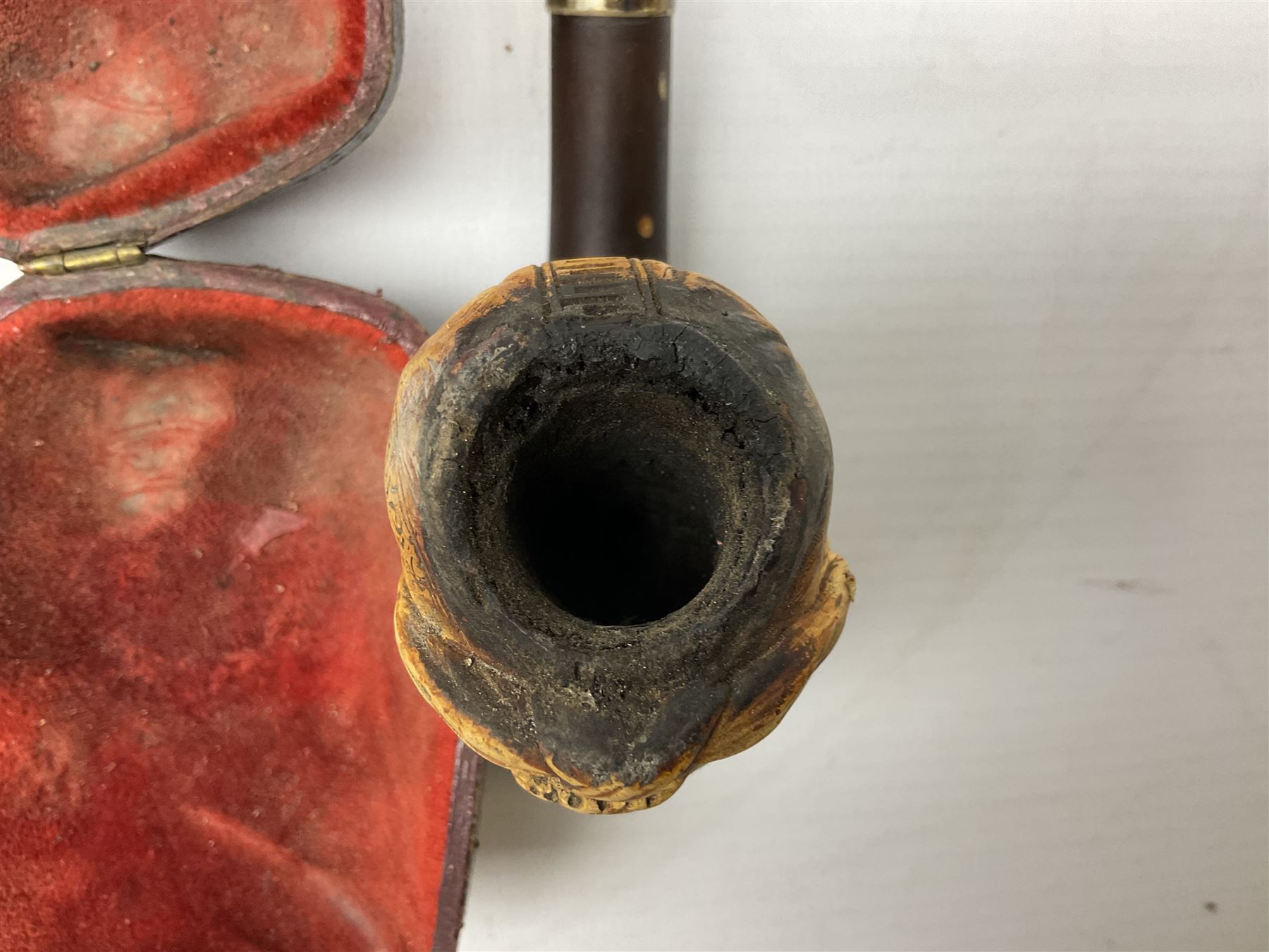 Carved meerschaum and amber pipe with silver mount, the bowl carved as a woman, cased, clay pipe in the form of an acorn, ceramic pipe, five other pipes and a ceramic bottle pourer in the form of a horse  