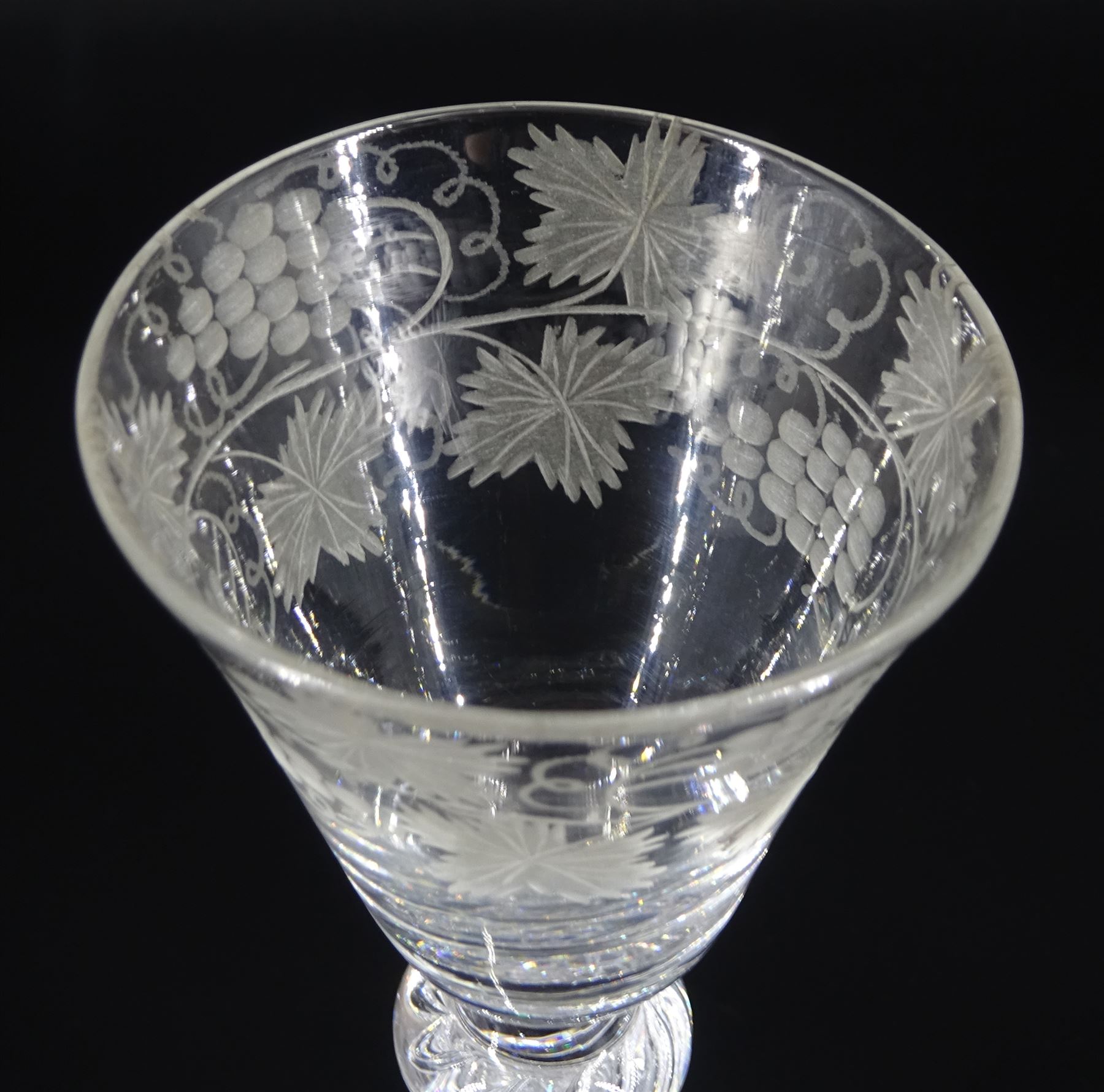 Mid 18th century wine glass, the funnel bowl engraved with fruiting vines upon a single series air twist double knopped stem and conical foot, H16.5cm
