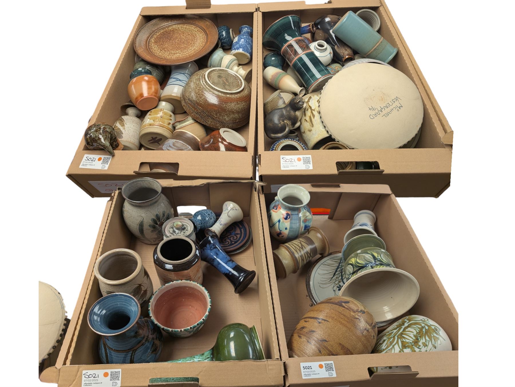 Collection of studio pottery, including bowls, vases, goblets and bottles, in four boxes 