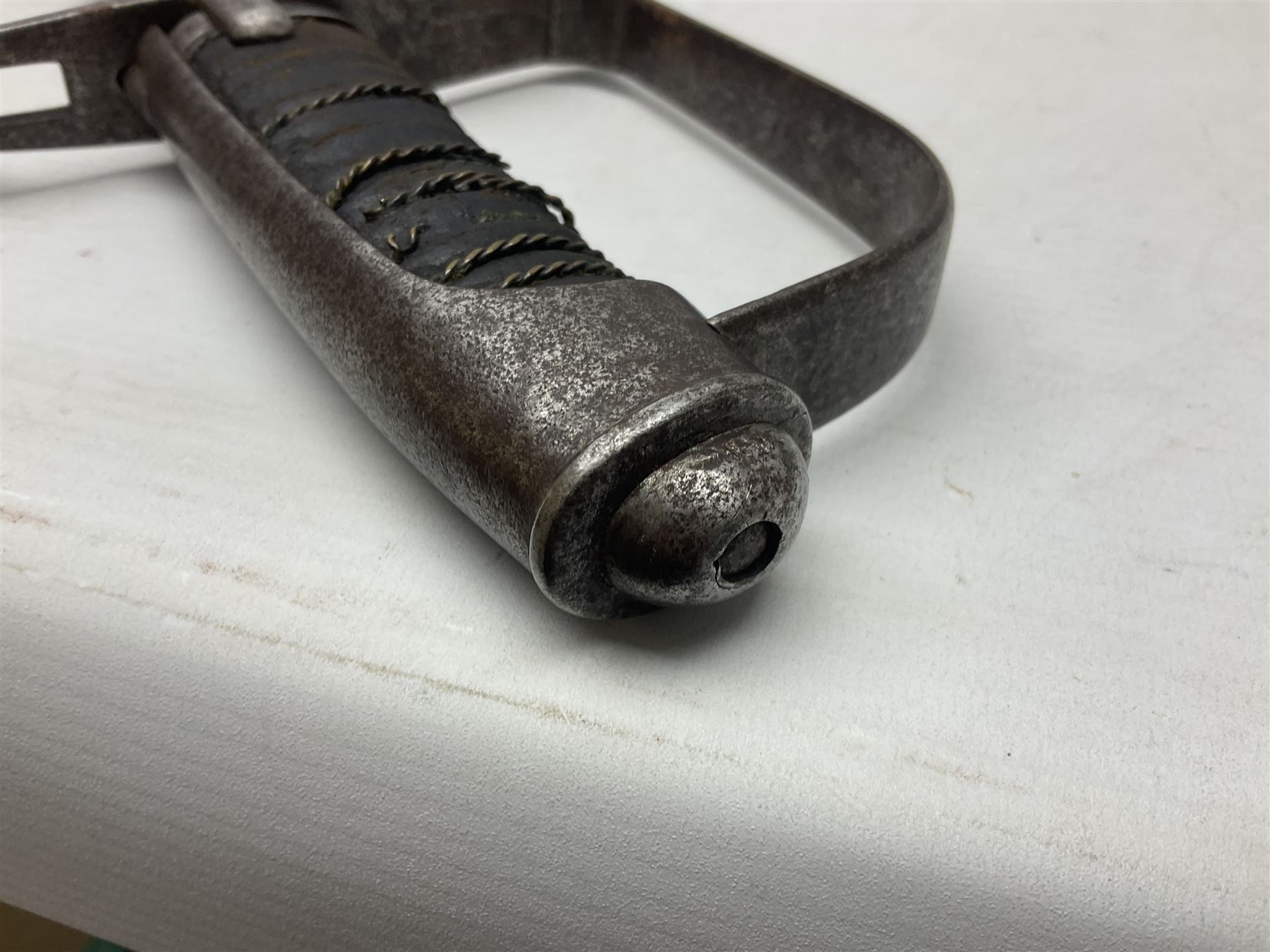 Italian M1833 Sabre with slightly curving 79cm fullered steel blade, the plain steel hilt with 'D' shaped knuckle bow, langets and wire-bound leather grip; in steel scabbard with single hanging ring L101cm overall