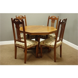  Arts & Crafts period octagonal dining table on four turned pillar supports (D122cm, H73cm), and set four oak dining chairs carved with floral motifs, upholstered in William Morris type fabric  