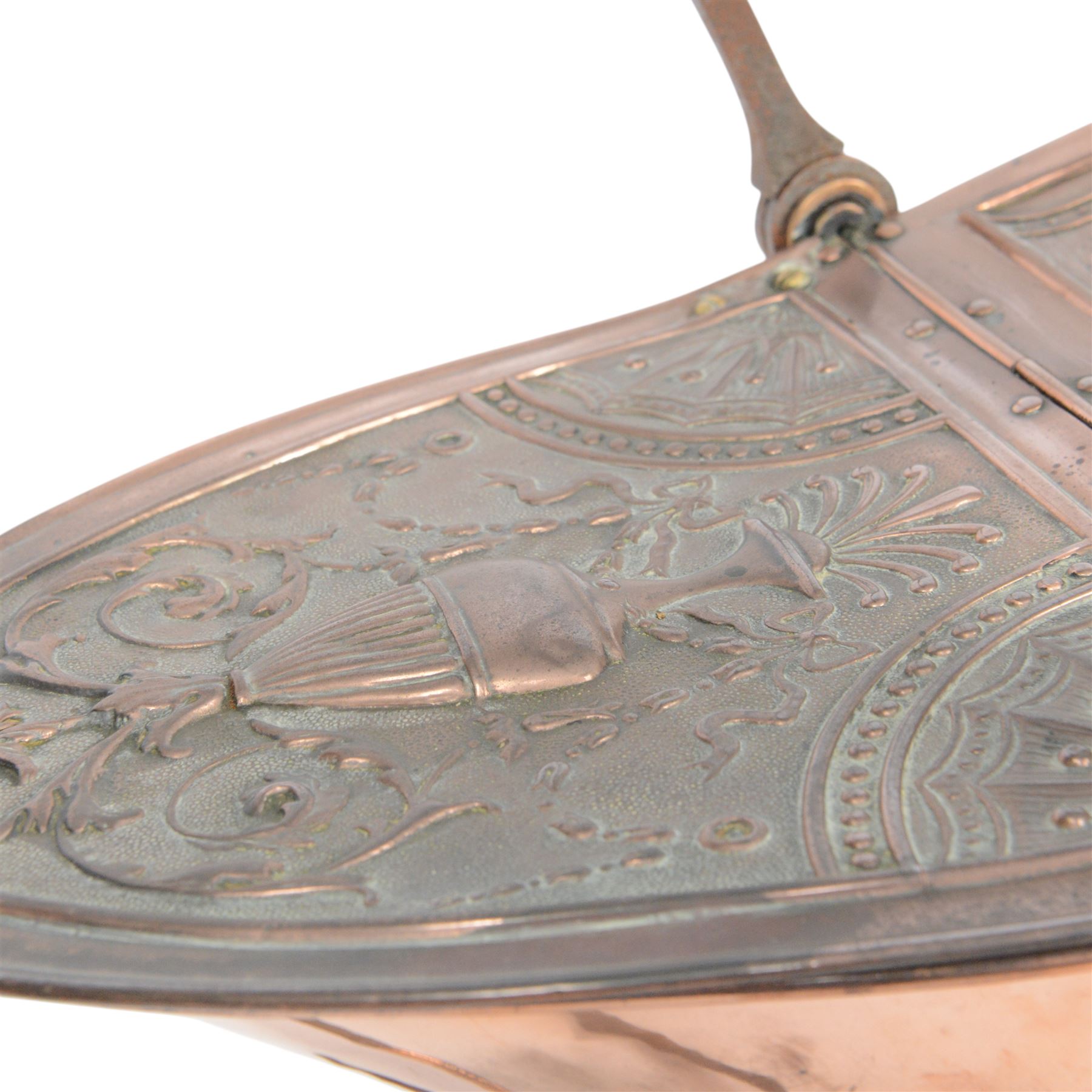 Victorian copper coal scuttle, the helmet shaped body tilting upon stand, with embossed hinged cover, turned wood handle and scoop H53cm
