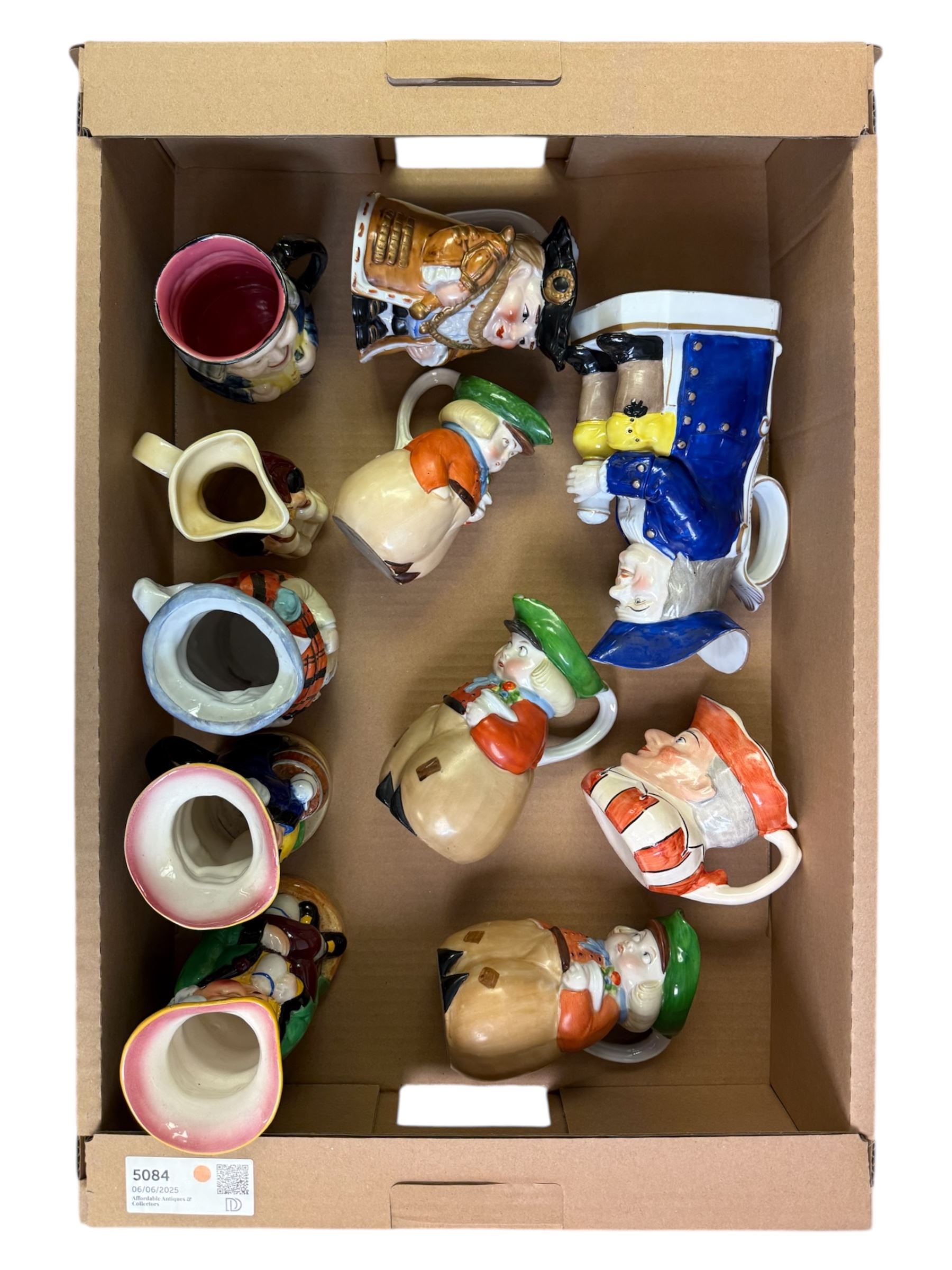 19th century ceramic toby jug with gold anchor mark to base, together with a collection of other toby jugs, tallest H21cm