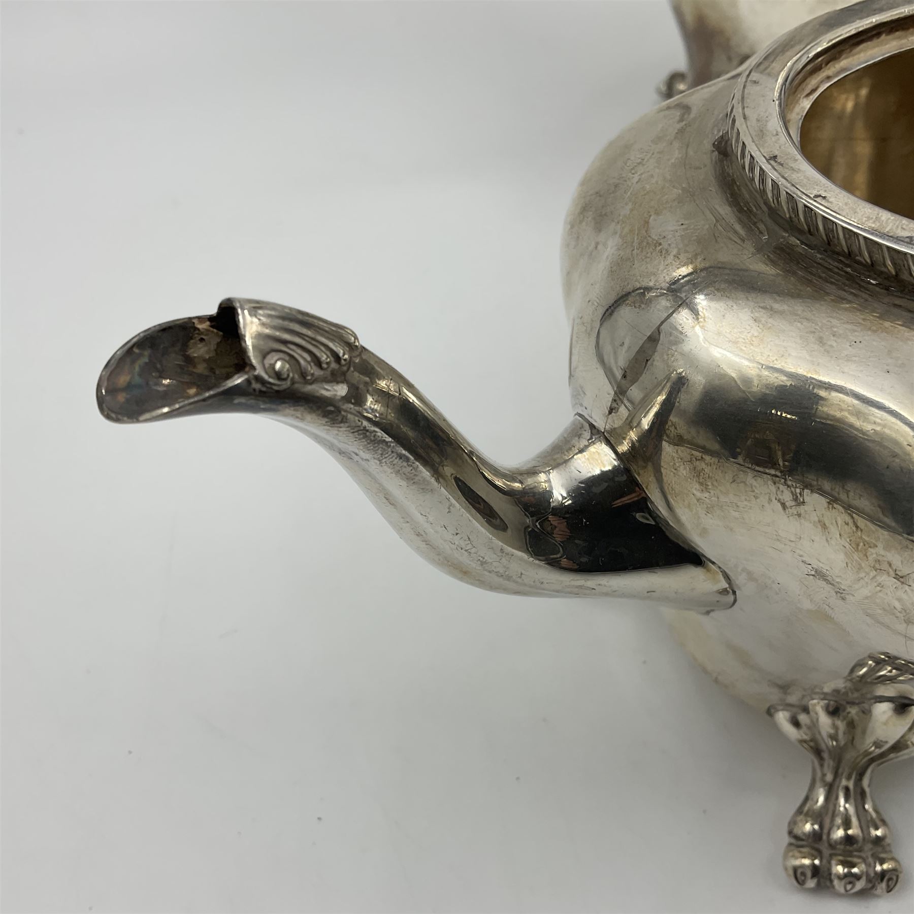 Five piece Edwardian silver tea service, comprising teapot and coffee pot, each with ebonised scroll handle, tea caddy with hinged cover, twin handled open sucrier, and milk jug, each of rounded bombe form, upon four paw feet, hallmarked William Adams Ltd, Birmingham 1904 and 1905, coffee pot H26cm
