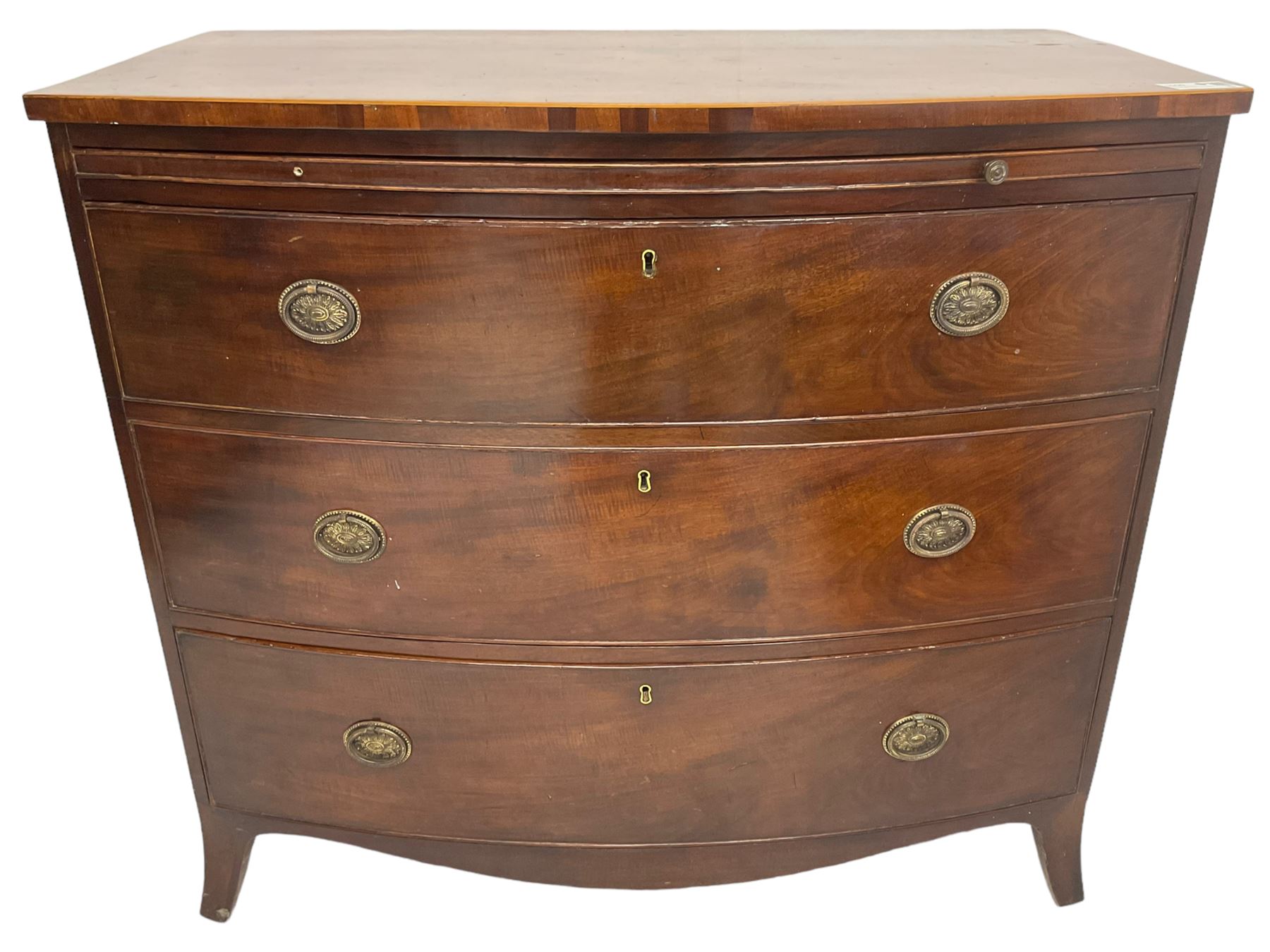 George III mahogany bow-front chest, shaped top with satinwood stringing, fitted with brushing slide over three graduating cock-beaded drawers, shaped apron over bracket feet