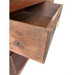 George III oak press cupboard, dentil cornice over two arch fielded panel doors, the base fitted with four drawers with pressed brass handle plates