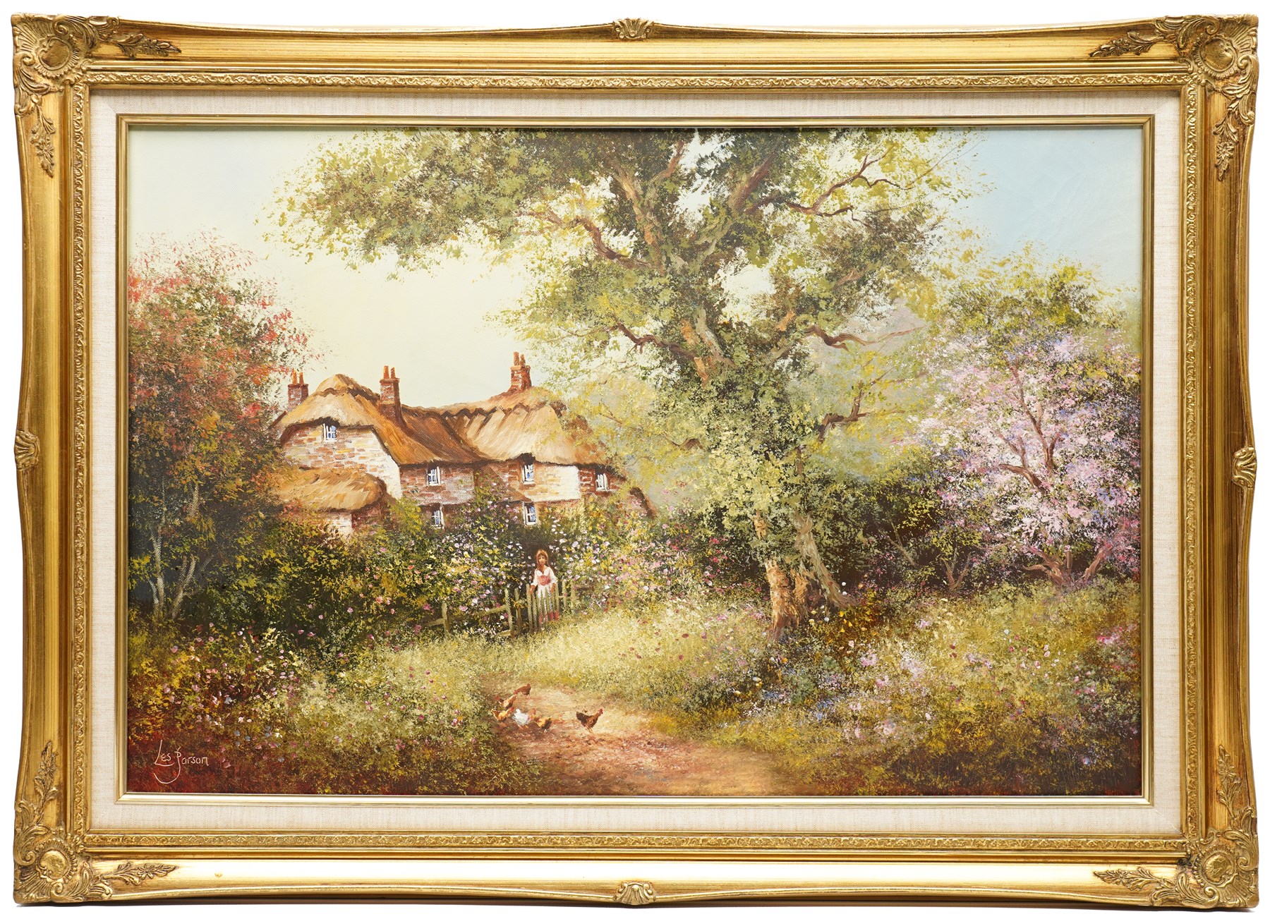 Les Parson (British 1945-): Thatched Cottage Overlooking a Blossoming Meadow, oil on canvas signed 49.5cm x 74.5cm