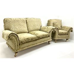 David Gundry upholstery of pale gold embossed fabric - two seat sofa, scrolling arms, tapering supports on castors (W180cm) and matching armchair (W100cm)
