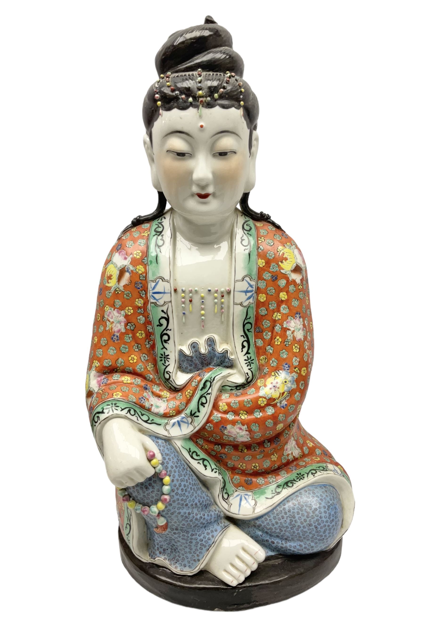 Tall Chinese polychrome figure of Guanyin (Guan Yin), the Goddess of Mercy and compassion, the Bodhisattva modelled seated and holding a rosary donning elaborate floral robes and beads, with four character seal marks beneath, H53cm