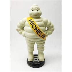 A cast iron Michelin man type figure, H40cm.