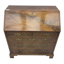 George III mahogany bureau, fall-front enclosing a fitted interior of drawers, pigeonholes and central mirrored cupboard, over four graduated cockbeaded drawers with brass batwing handles, raised on bracket feet