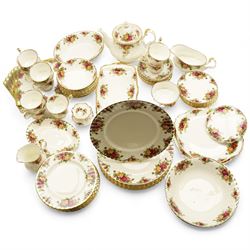 Royal Albert Country Roses tea and dinner service, teapot, milk jug, covered sucrier, eight dinner plates, eight teacups and saucers 