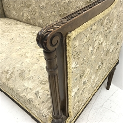 Edwardian mahogany framed two seat sofa, acanthus carved scrolling arms, turned tapering reeded supports, upholstered in a beige ground floral fabric, W126cm 