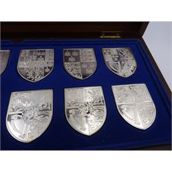 Yorkshire Mint, The Royal Arms Collection, twelve shield shaped silver medallions each depicting variations on the Royal coat of arms, each hallmarked Yorkshire Mint, Birmingham 1976/77, contained within fitted wooden case with associated information cards