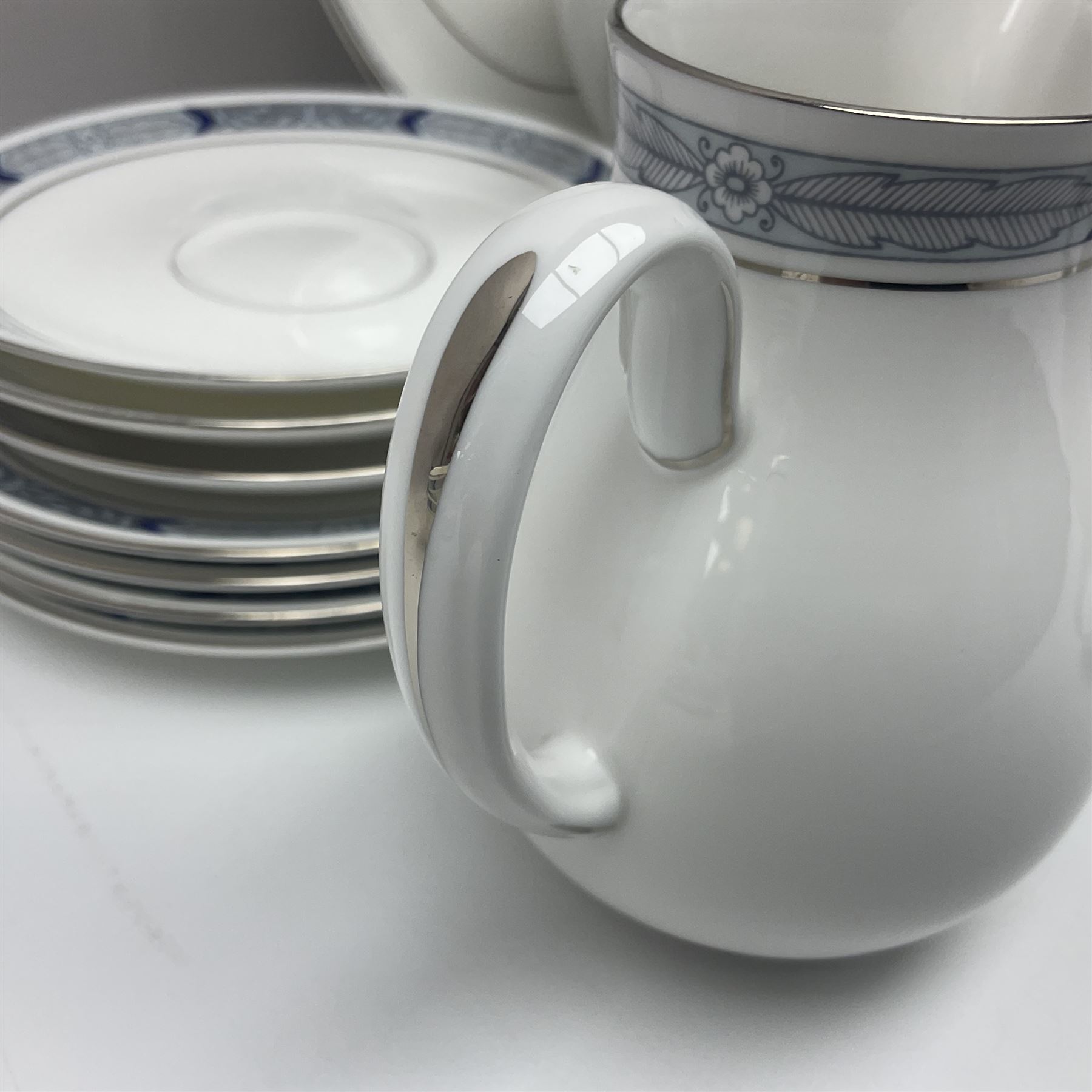 Royal Worcester Beaufort tea service, comprising teapot, milk jug, open saucier, eleven teacups, twelve saucers, eight dessert plates and one cake plate