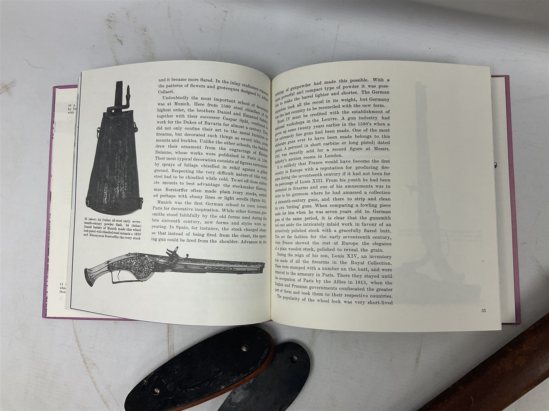 George V 1897 pattern Infantry officers sword, the 82cm single fullered blade with traces of etched detail and George V crown cipher, the ricasso marked Hawksworth Sheffield, pierced half basket hilt with George V cypher, wire-bound fish-skin grip with brass pommel and backstrap; in leather scabbard L102cm overall; together with two sectional gun cleaning rods; swagger stick made of leather strips etc