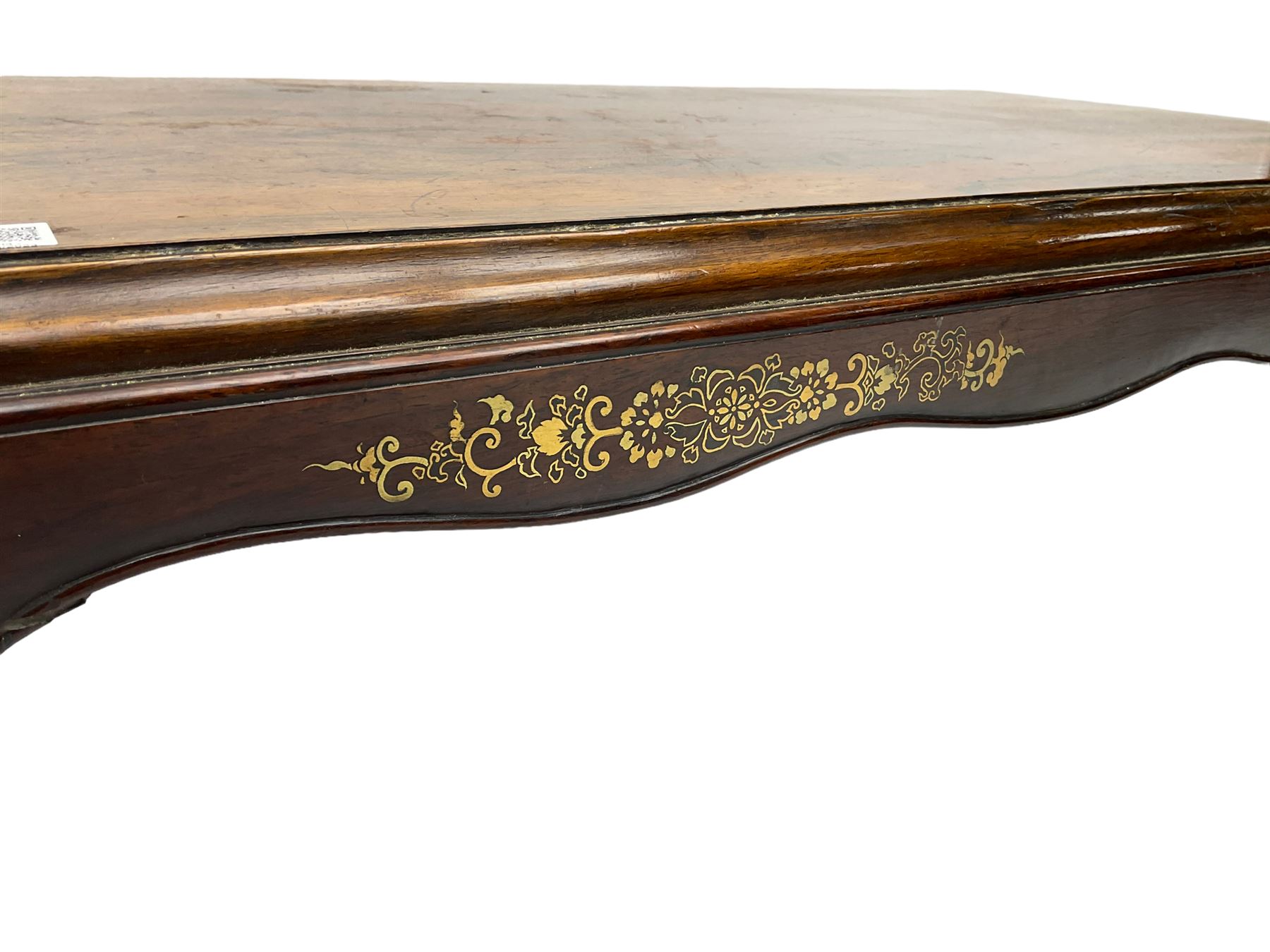 19th century rosewood opium table, rectangular top with moulded edge, the shaped apron decorated with applied brass scrolling foliate detail, raised on shaped supports with stylised leaf feet and cockbeaded edge