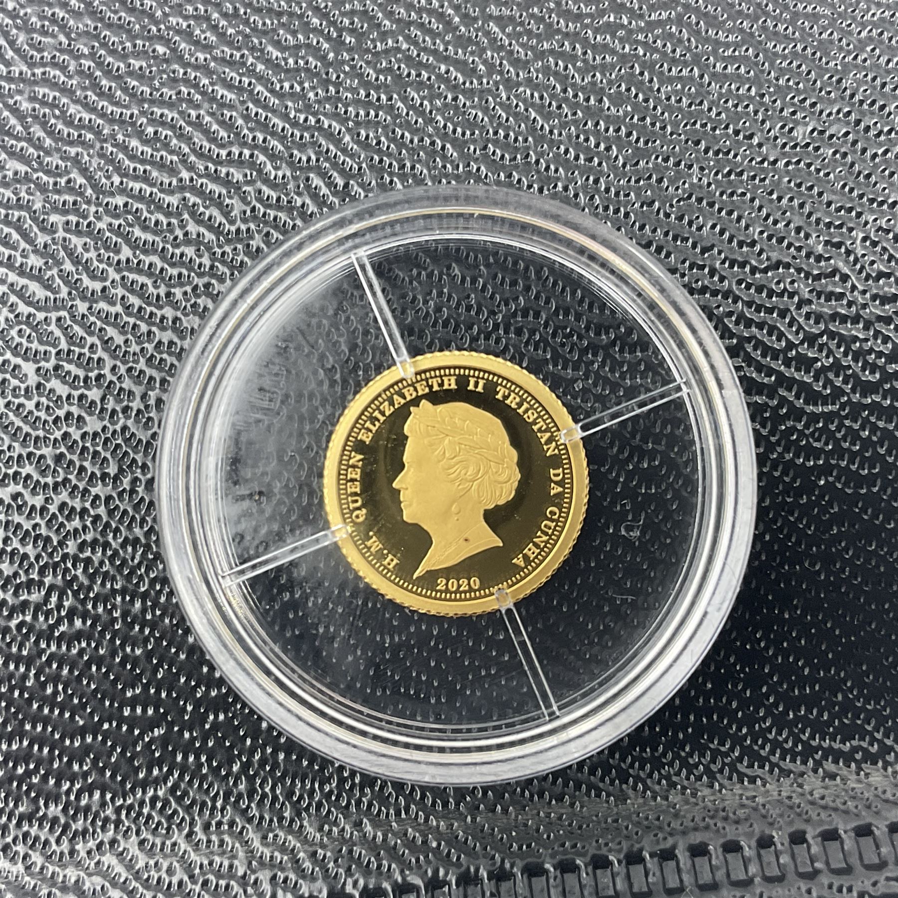 Eleven Queen Elizabeth II miniature gold coins, each being 0.5 grams of 24 carat gold, including Tristan da Cunha 2020 'Laurel', Solomon Islands 2020 '80th Anniversary of the Battle of Britain' etc, all with certificates