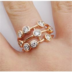 Rose gold nine stone round brilliant diamond contemporary design ring, stamped 9K, total diamond weight 1.35 carat