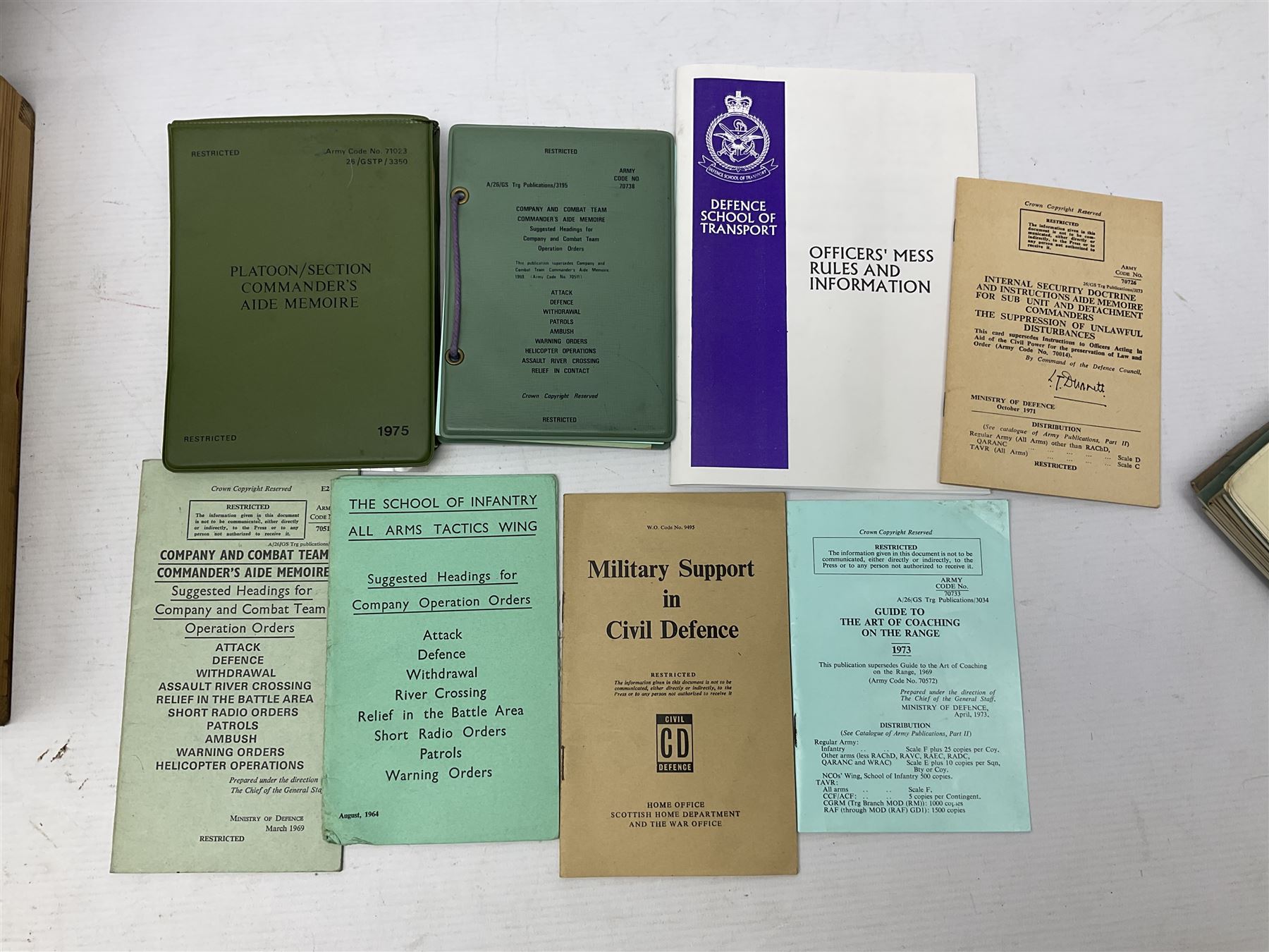 Collection of nineteen British Army booklets 1940s - 1970s including Small Arms Training 1944, various Infantry Training, Cadet Training Manual 1978, Signal Training, Commander's Aide Memoires etc; 1950s blue beret with Yorks Brigade badge; part travelling toilet set in cloth roll; all contained in pine box with webbing straps