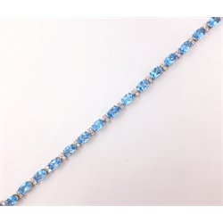  18ct white gold blue topaz and round brilliant cut diamond bracelet stamped 750 diamonds approx 0.8 carat topaz approx 12 carat  