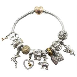Silver Pandora bracelet with 14ct gold plated heart clasp, with twelve Pandora charms, including Santa's sleigh, Christmas elves, reindeer, fairy, snowflake and polar bear, some with 14ct gold plated accents, with Pandora box and bag