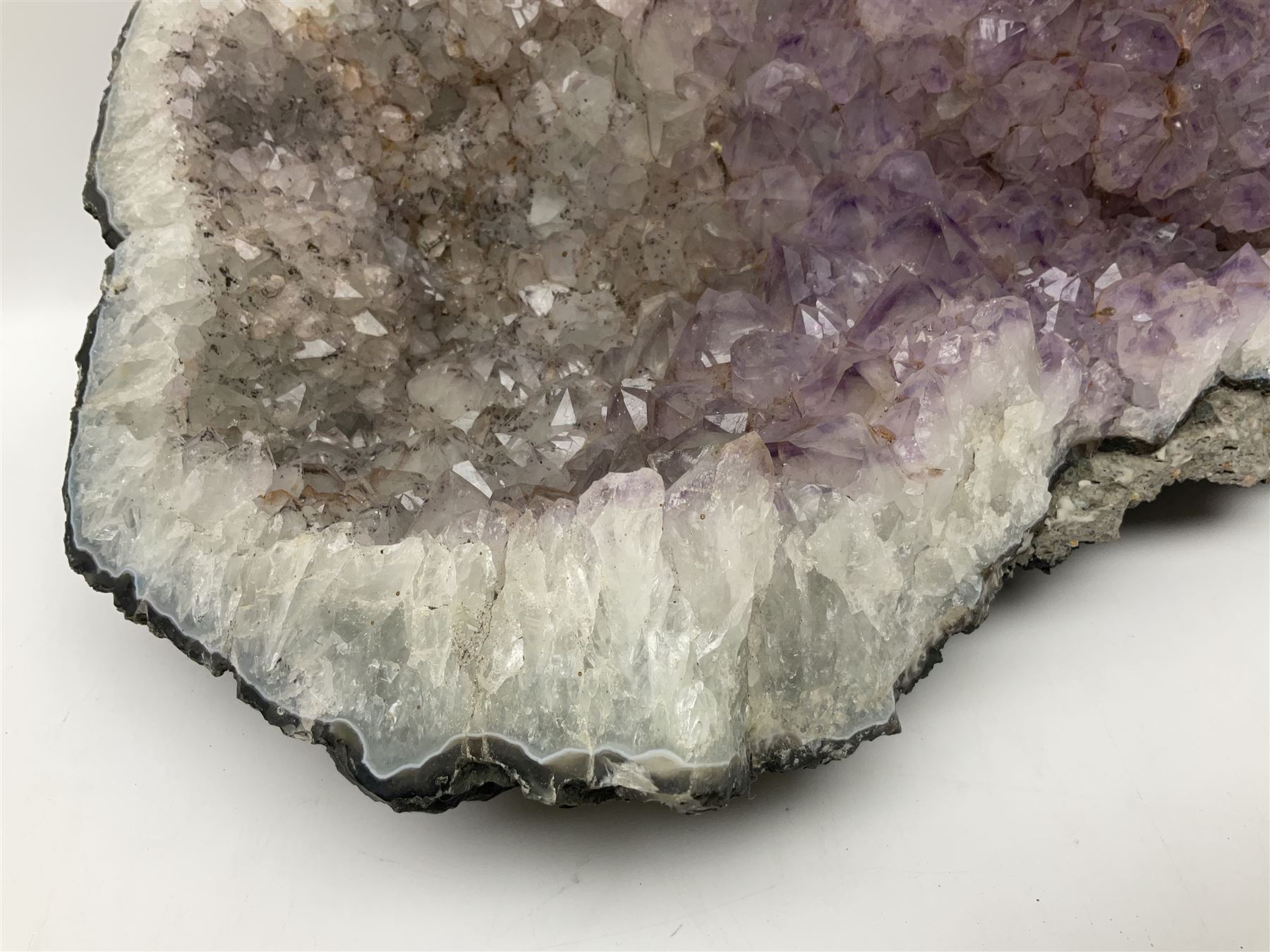 Amethyst crystal geode cluster, with well-defined crystals of various sizes, H13cm, L46cm