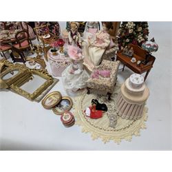 Dolls house living room and ding room furniture, including sofa, chair, long case clock, Christmas trees, fireplace, dresser, chairs, tables, mirrors, seven figures and a collection of predominantly Christmas themed decorations, food, etc