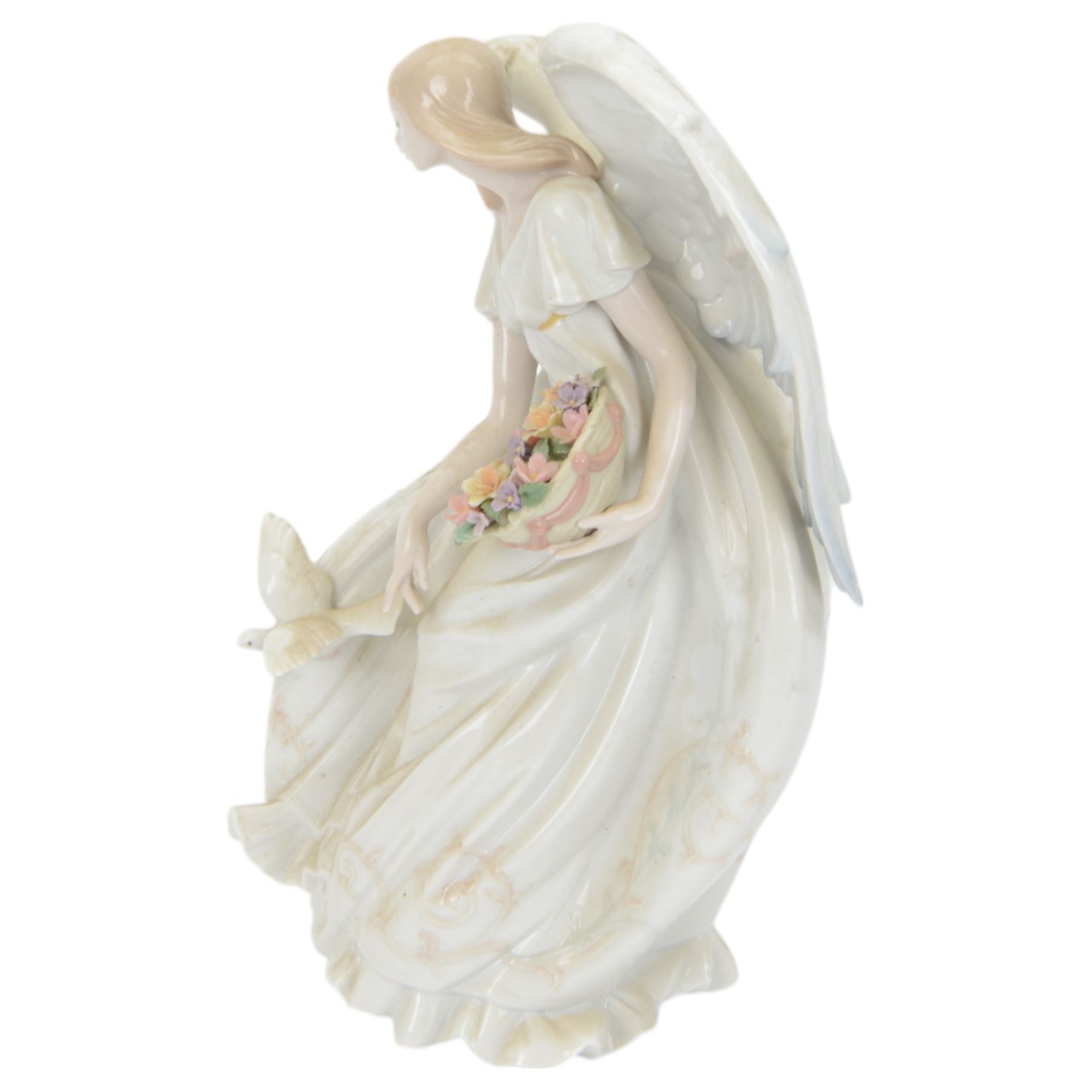 Lladro figure Flowers of Peace, modelled as an angel holding flowers, no 1867, H33cm