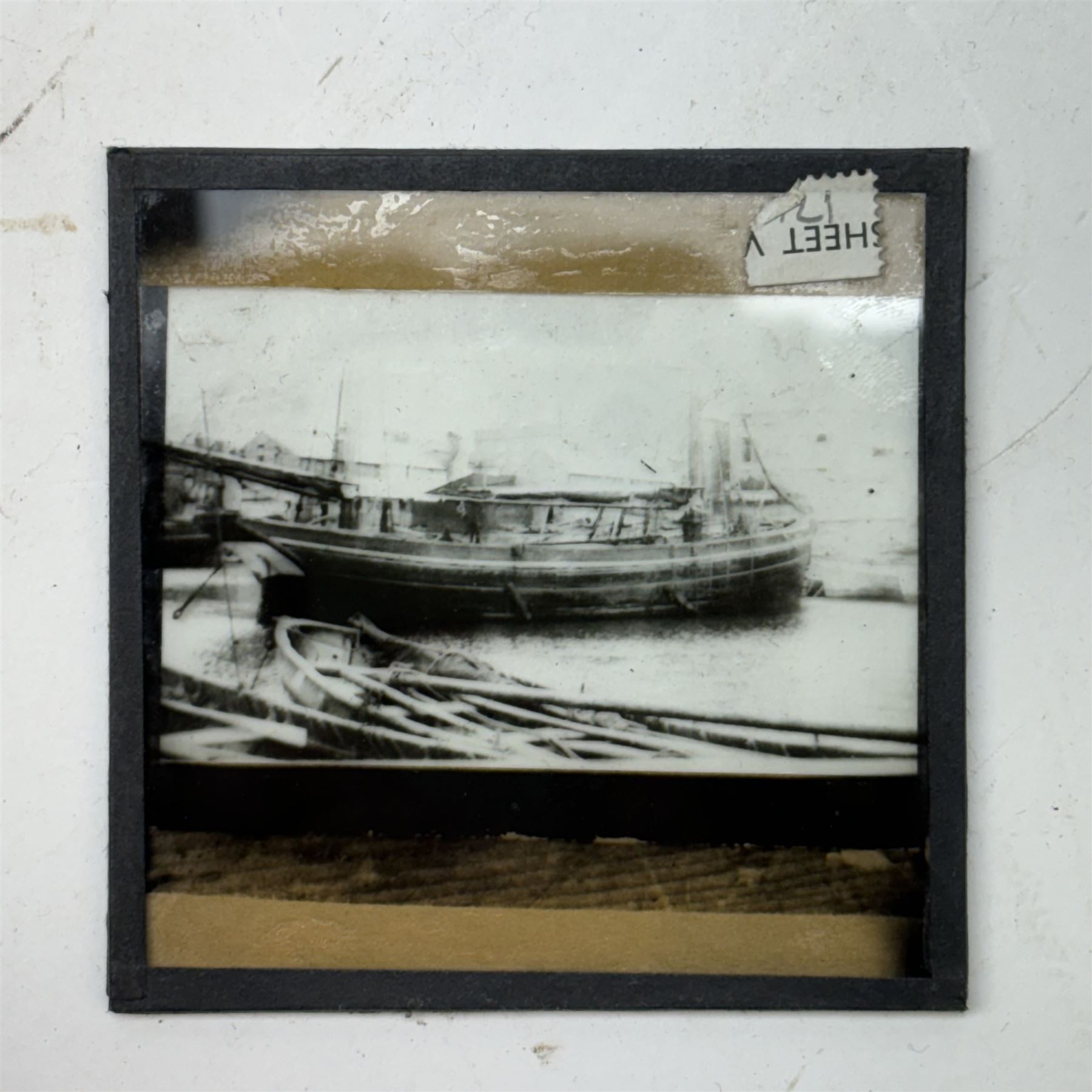 Collection of magic lantern slides, including examples by Graystone Bird of Bath and scenes of Old Scarborough, in wooden box