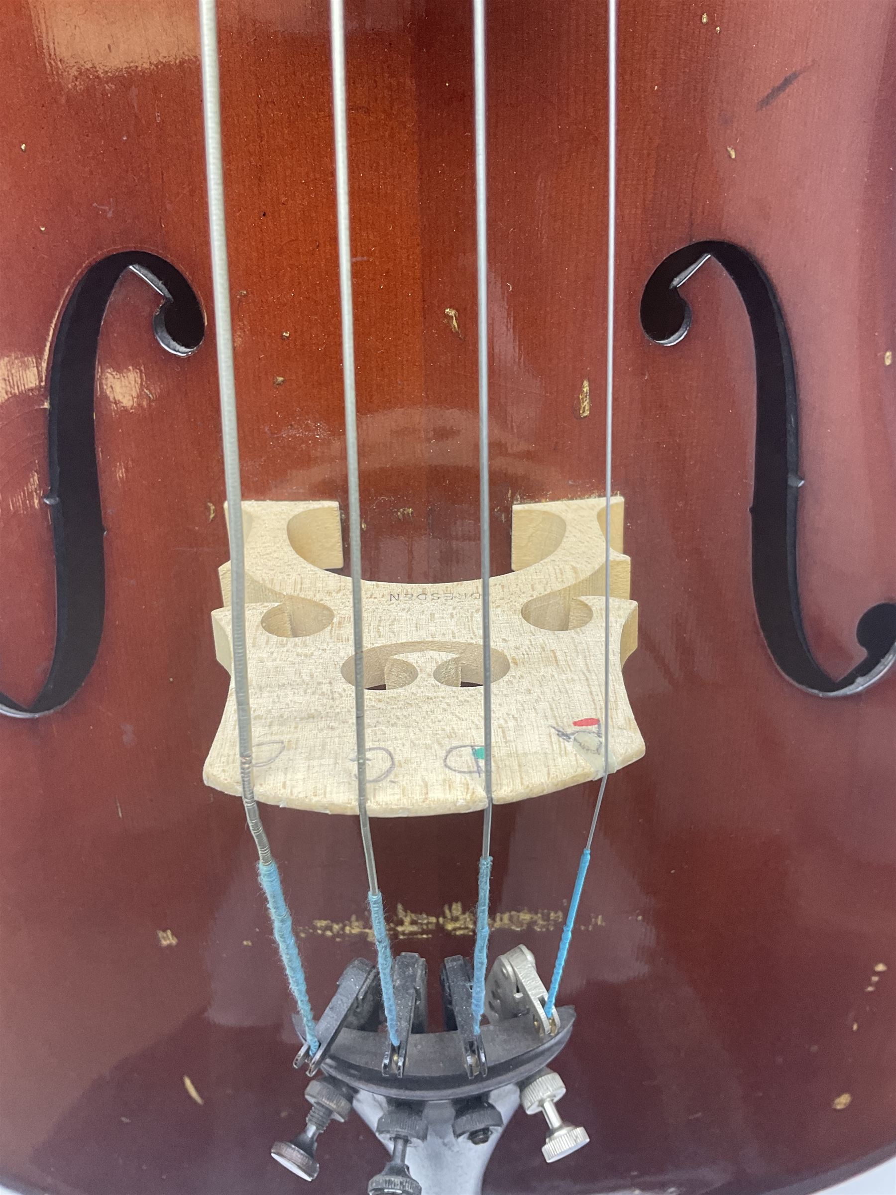 Two student half-size cellos - Boosey & Hawkes Artia with 65cm one-piece back and spruce top; bears maker's label; L104cm overall; and Romanian with 65.5cm two-piece maple back and ribs and spruce top; bears label; L108.5cm overall; each in soft carrying case with two bows (2)