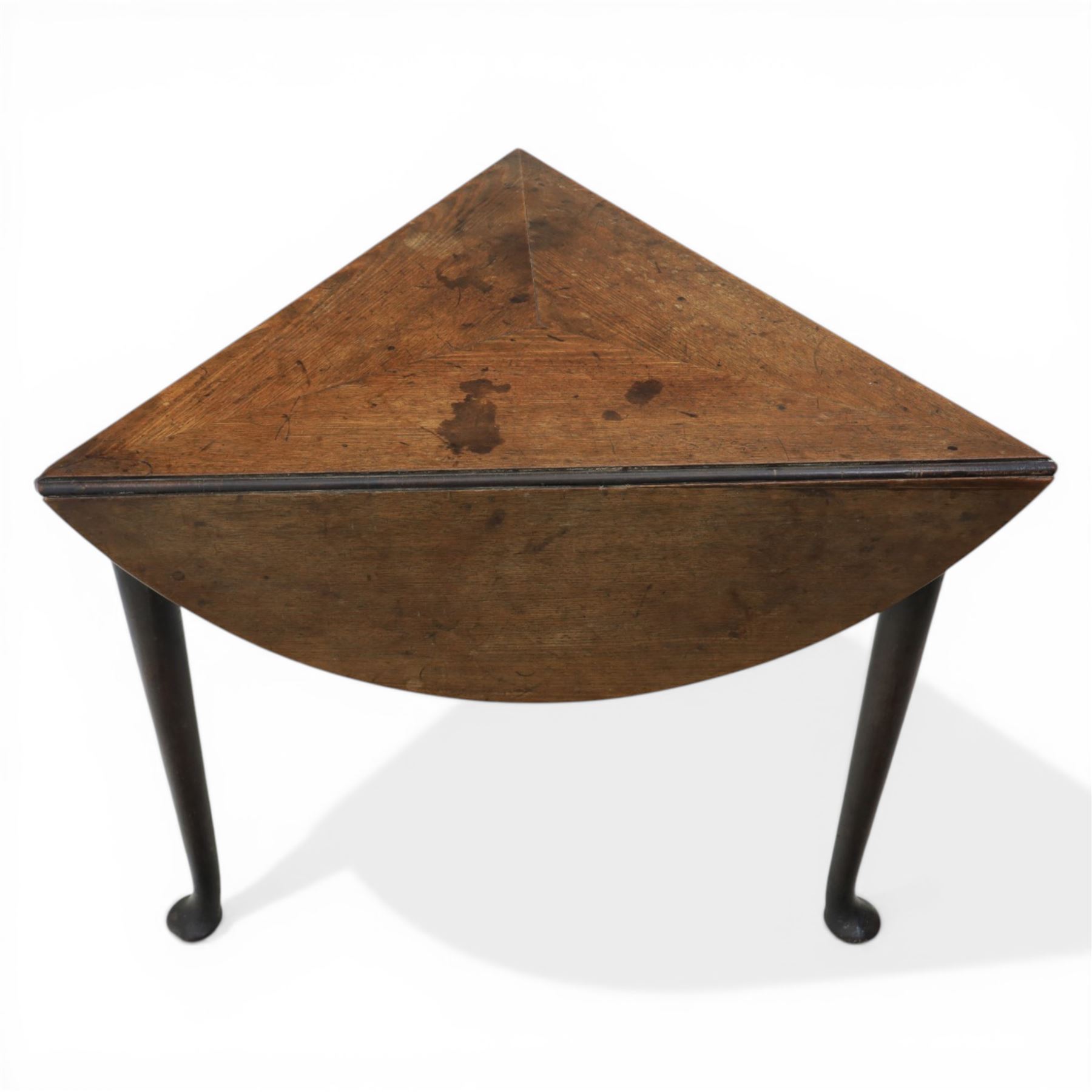 18th century oak folding cricket table, triangular top with three hinged demi-lune leaves, raised on tapering supports with pad feet