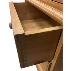 Solid pine double wardrobe, fitted with top box, enclosed by panelled doors, two short and one long drawer, on plinth base 