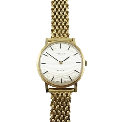  Tissot Stylist 9ct gold Gents wrist watch with baton numerals, on articulated strap, presentation dated 1973  
