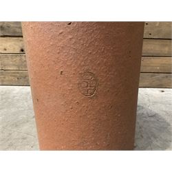 Cast iron cauldron set pot with 2 terracotta chimney pots and 2 terracotta planters,