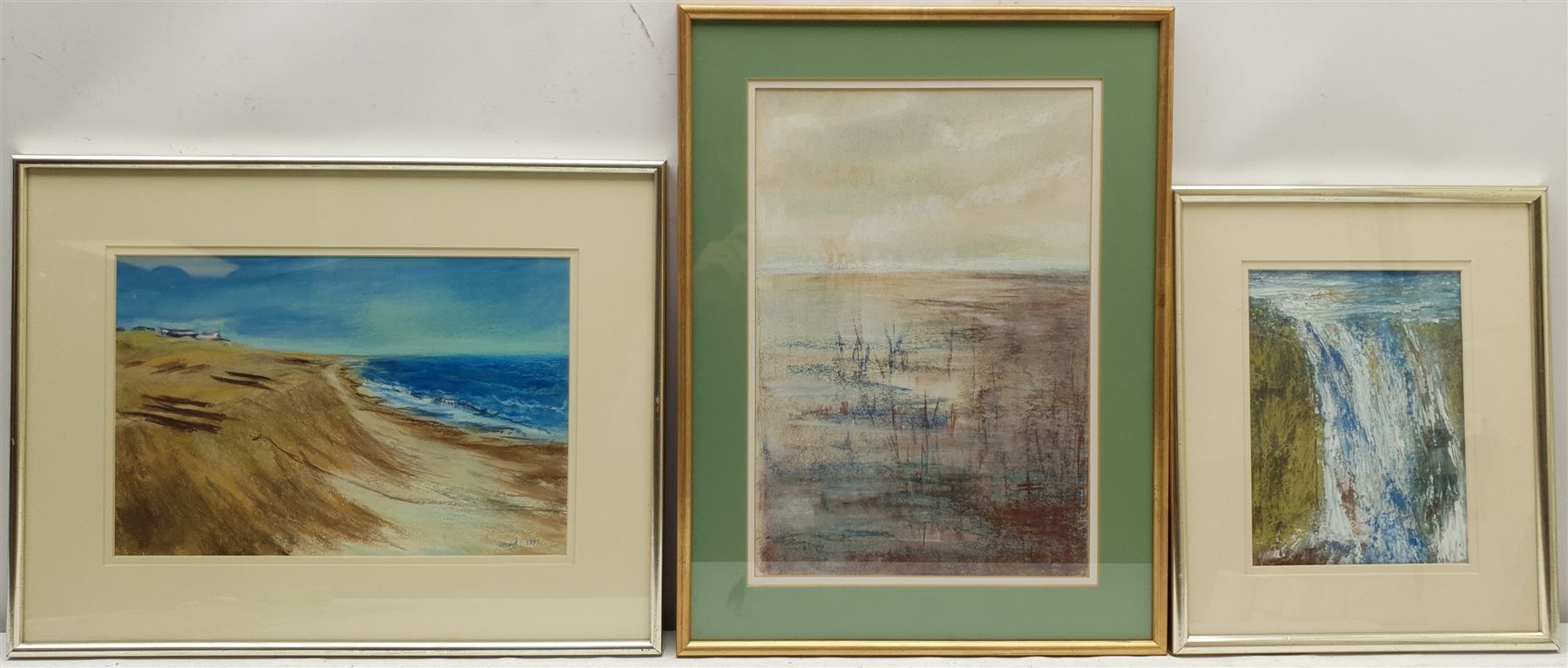 Madeleine Eyland (Belgian/British 1930-2021): 'Suffolk Coast', Marshy Landscape and 'Waterfall', three pastels signed, max 38cm x 26cm (3) 
Provenance: artist's studio collection. Marie-Madeleine Eyland (neé Legrain) was born in 1930 at Floriffoux, Belgium; she lived most of her life in Scarborough working as a nurse and an artist.