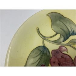 Moorcroft Tiger Lily pattern plate on a yellow ground, with painted and impressed mark beneath, D26cm