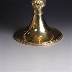 Mid 20th century silver-gilt chalice, the goblet with hammered finish upon knopped stem, the knop embossed with symbols and foliate decoration, engraved to base ' veni non ministrari sed ministrare' and with presentation engraving to underside, hallmarked Guild of Handicraft, London 1957, H17cm