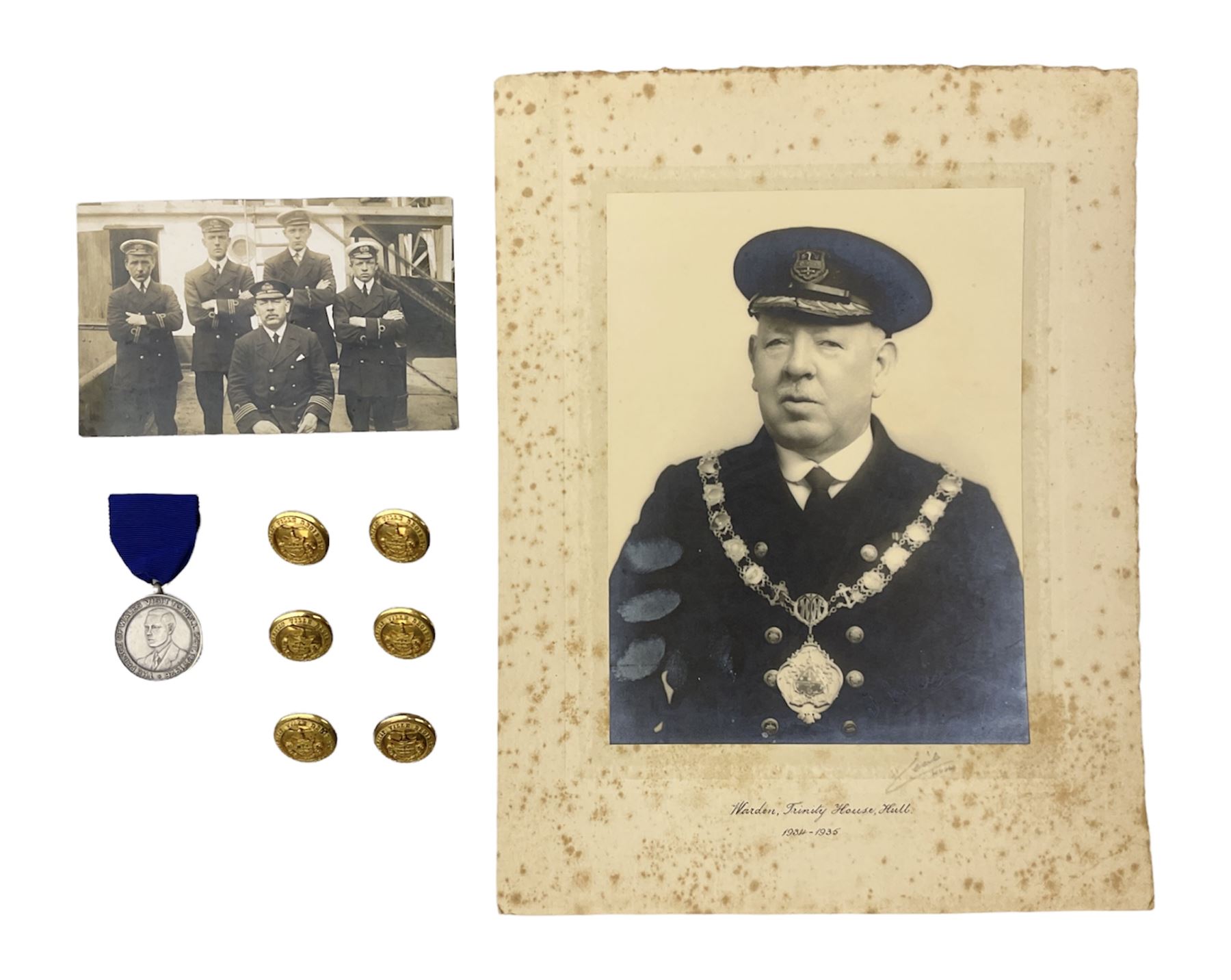 Trinity House Hull - hallmarked silver medal commemorating the visit of the Prince of Wales October 13th 1926; photograph of Captain J. Collins Warden 1934-35; photographic postcard of Capt. Collins onboard ship with other crew members; and six Trinity House uniform buttons