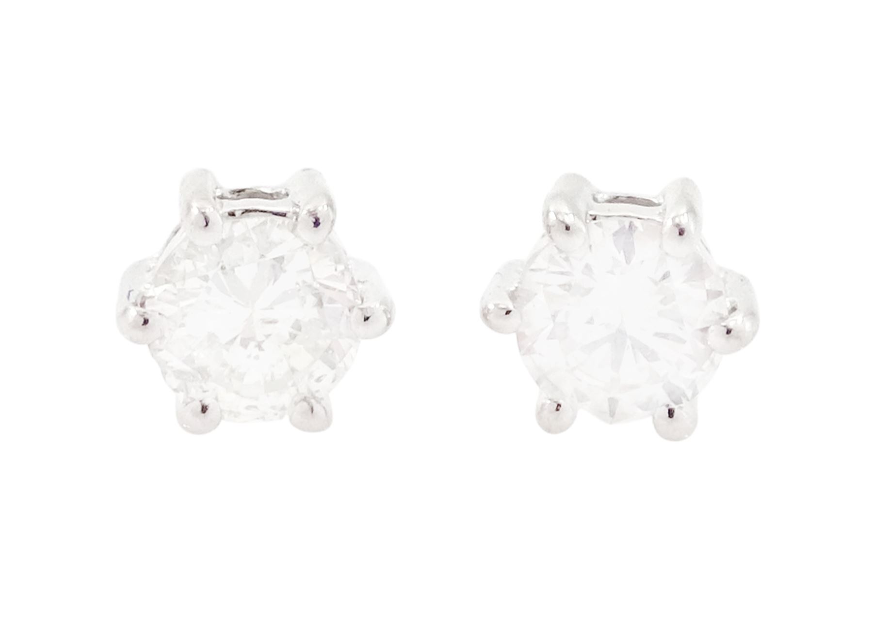 Pair of 18ct white gold diamond earrings, each stud six claw set with a round brilliant cut diamond, total diamond weight approx 0.30 carat