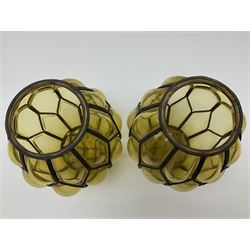 Pair of 20th century blown amber glass lanterns, the bodies of ovoid form with metal frames, H21cm