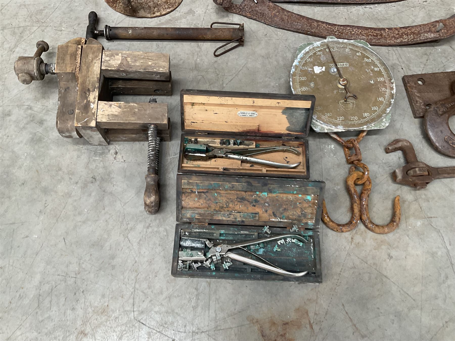 Large quantity of vintage hand tools including scales, scythes, saws etc