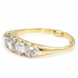 Early 20th century 18ct gold diamond ring, set with five graduating old cut diamonds and diamond accents, total diamond weight approx 1.55 carat