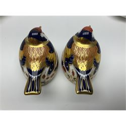 Two Royal Crown Derby Goldfinch Nesting paperweights with silver stoppers, together with two Royal Crown Derby imari pin dishes, largest dish D13cm