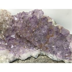 Amethyst crystal geode cluster, with well-defined crystals of various sizes, H13cm, L46cm