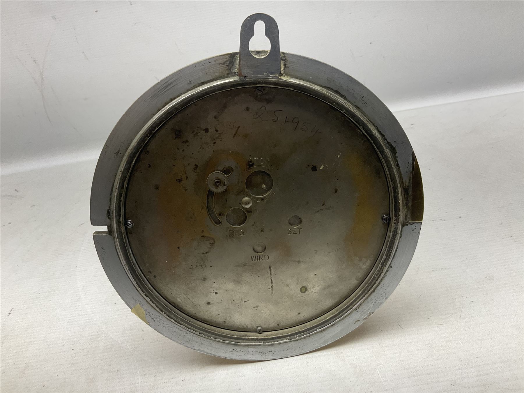 WWII period US Navy Mark I deck clock, the black circular dial with Arabic numerals,  luminous dot markers and subsidiary seconds dial marked 'Mark I Deck Clock U.S. Navy 15211 1941', in bronze bulk head case D20cm; and a Loose-Wiles Biscuit Company octagonal tin decorated with nine different US Warships (2)