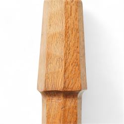 Squirrelman - oak standard lamp, the octagonal stepped base carved with the signature squirrel, the tapering octagonal column rising to a brass fitting, by Wilfrid Hutchinson, Husthwaite