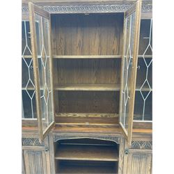 Old Charm oak four door glazed bookcase on cupboard
