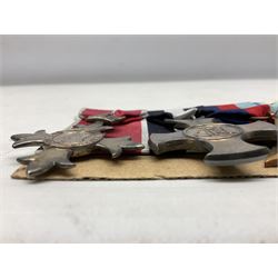 WW2 Royal Naval group of eight medals comprising OBE, hallmarked silver Distinguished Service Cross inscribed verso Lieut. J.R. McCluskie RNVR 1945, 1939-1945 Star, Atlantic Star, Africa Star, 1939-1945 War Medal, Defence Medal and Royal Naval Patrol Service Medal inscribed Lieutenant J.R. McCluskie Royal Naval Patrol Service; with seven original photographs of a sea battle 27th November 1940 against the Italian Fleet and another photographic postcard of Sir Stafford Cripps arriving on board one of the vessels.