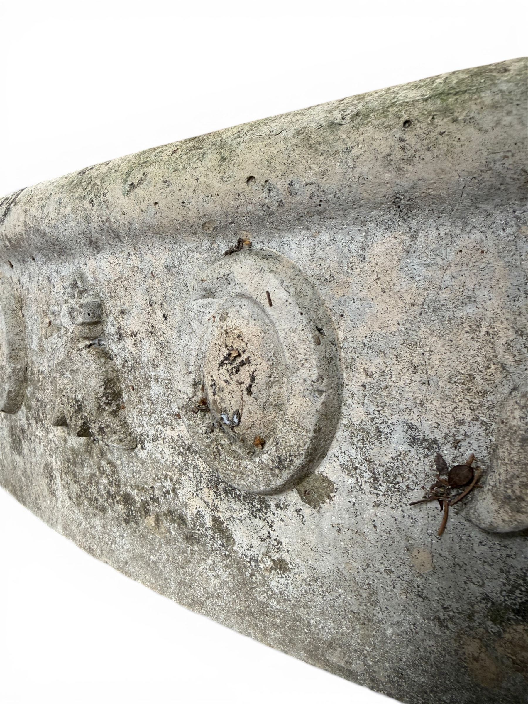 Cast stone planting circle, detailed with flower motifs and roundels